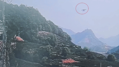 村民操控无人机穿越铁路喷农药引发关注，临近高压电线安全问题凸显